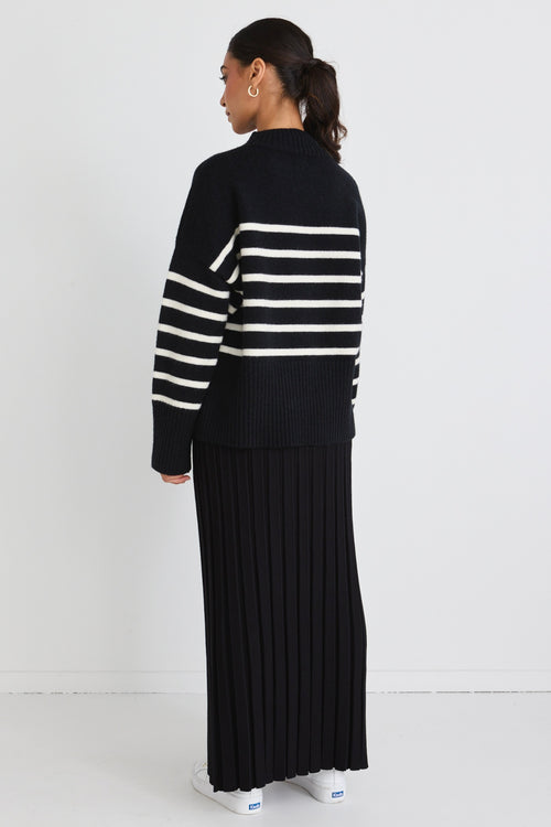model wears Black Pleated Knit Maxi Skirt