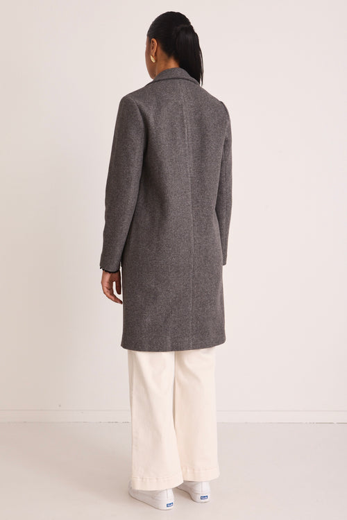 model wears a Grey Wool Coat 