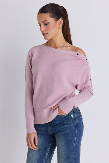 Model wears a pink batwing jumper