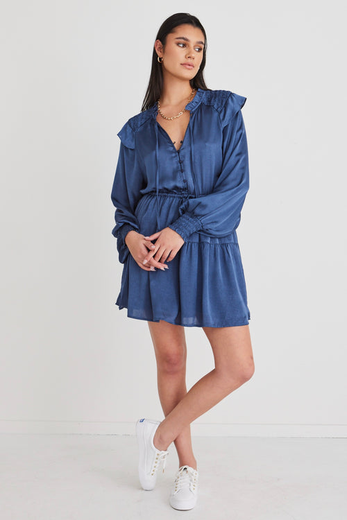 model wears a blue mini dress