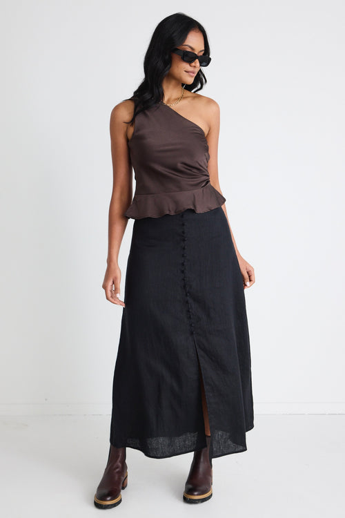 model wears a black linen skirt