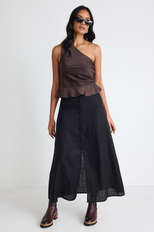 model wears a black linen skirt