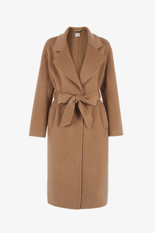 model wears a brown wool coat