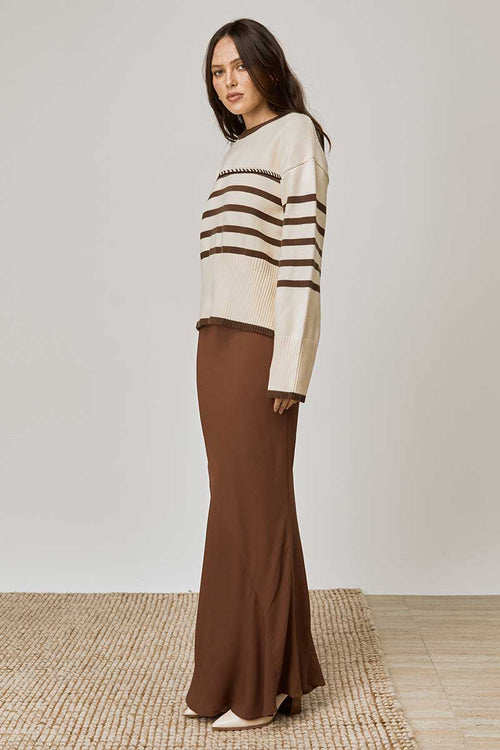 model wears a beige tan stripe knit