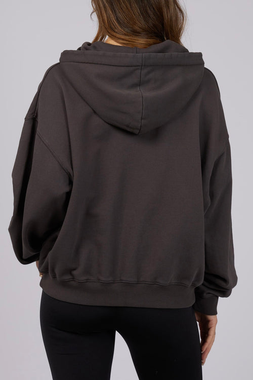 model wears a black hoodie