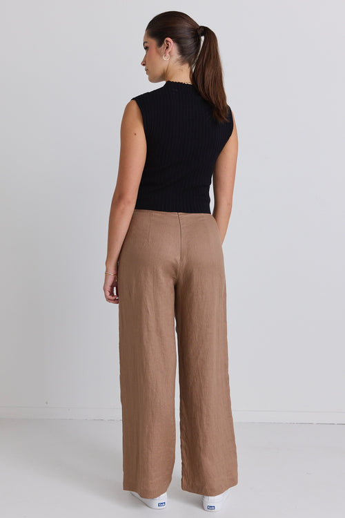 model wears brown linen pants