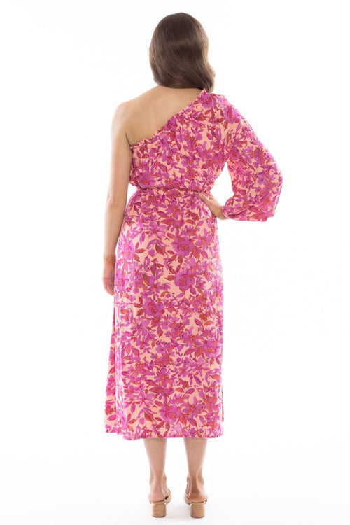 model posing in pink floral long sleeve midi dress