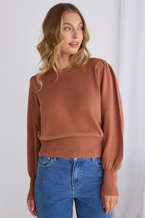 model wears a brown knit
