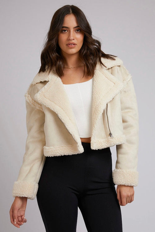 model wears a white jacket