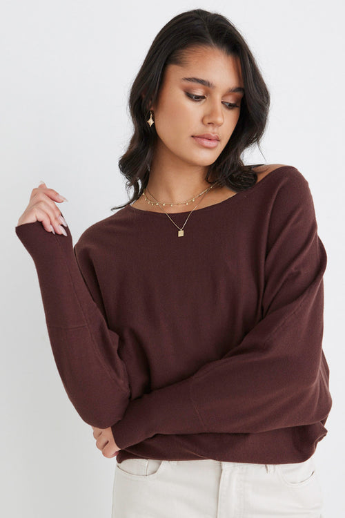 Model wears a brown knit
