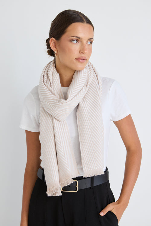 model wears a cream scarf