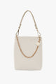 Coco Alabaster Leather Bucket Bag with Gold Chain Detail